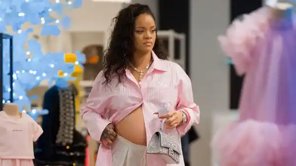 Rihanna shows her bump while shopping