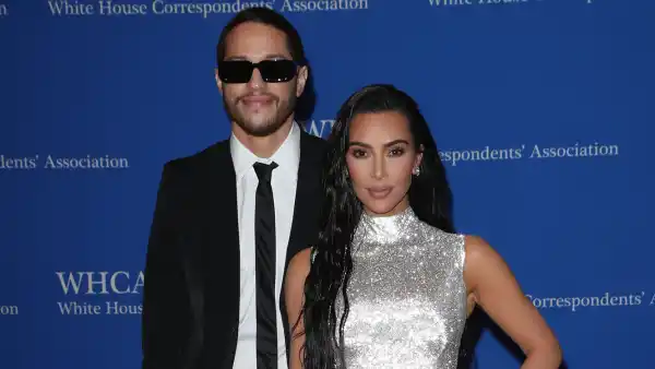 Pete Davidson in suit and sneakers, Kim Kardashian in silver gown