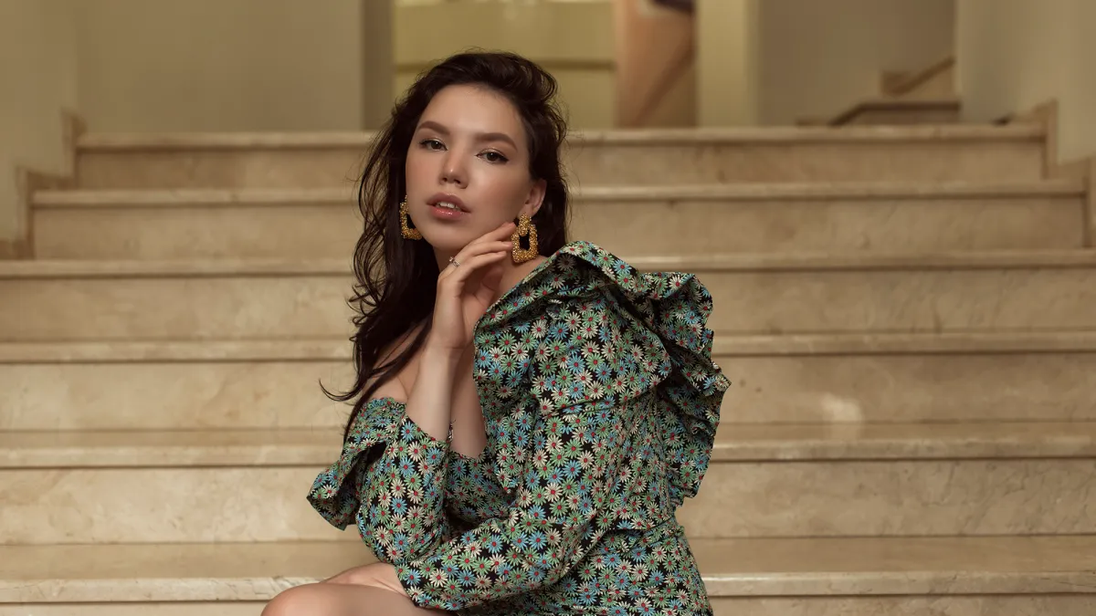 Young woman walking in summer city