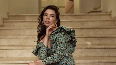 Young woman walking in summer city