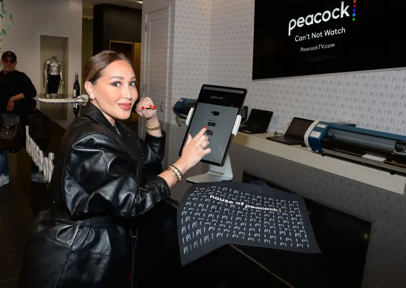 Adrienne Bailon stopped by Peacock’s month-long awards FYC immersive fashion experience HOUSE OF PEACOCK at the Grove highlighting the streamer’s breakout shows