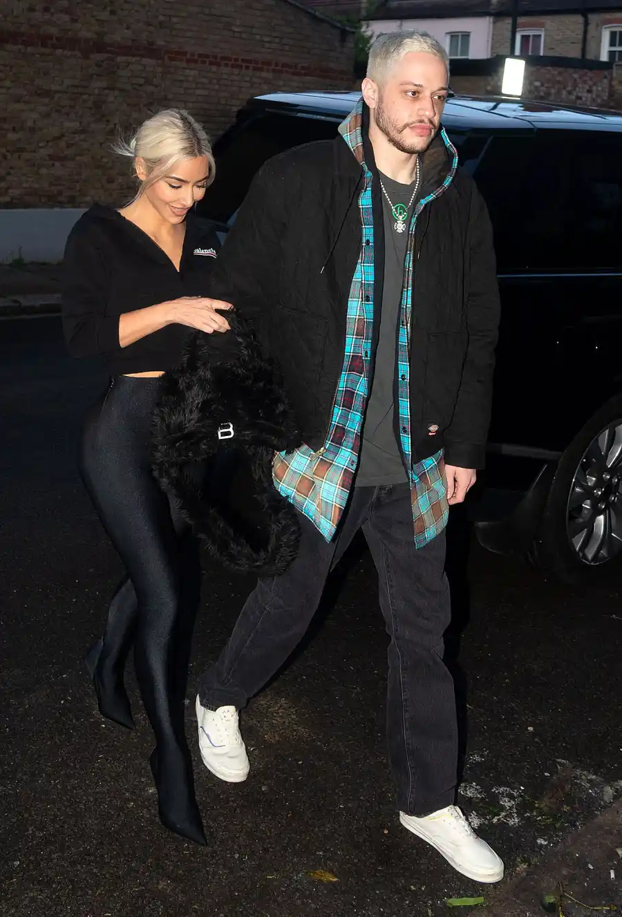 Kim Kardashian Holds Pete Davidson Tight as They Arrive in London 7
