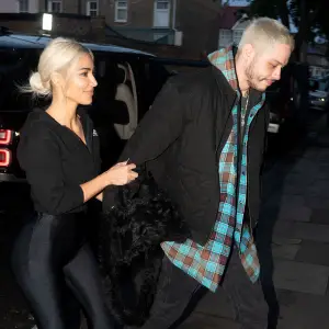 Kim Kardashian Holds Pete Davidson Tight as They Arrive in London 9