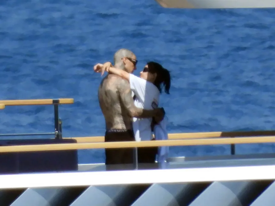 Kourtney Kardashian and Travis Barker Arrive in Italy Ahead of 3rd Wedding