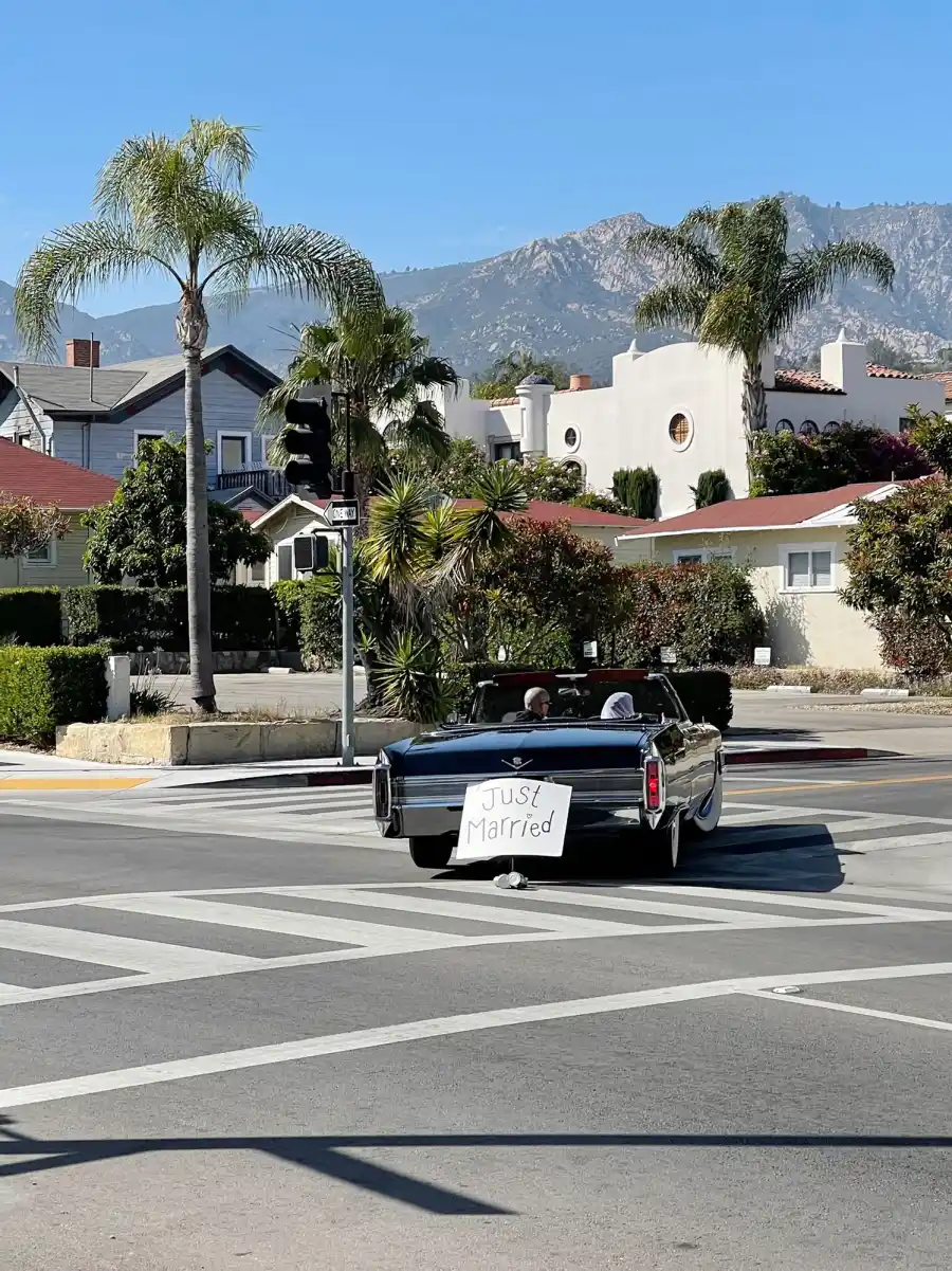 Travis Barker and Kourtney Kardashian drive away in black convertible with 'Just Married' sign