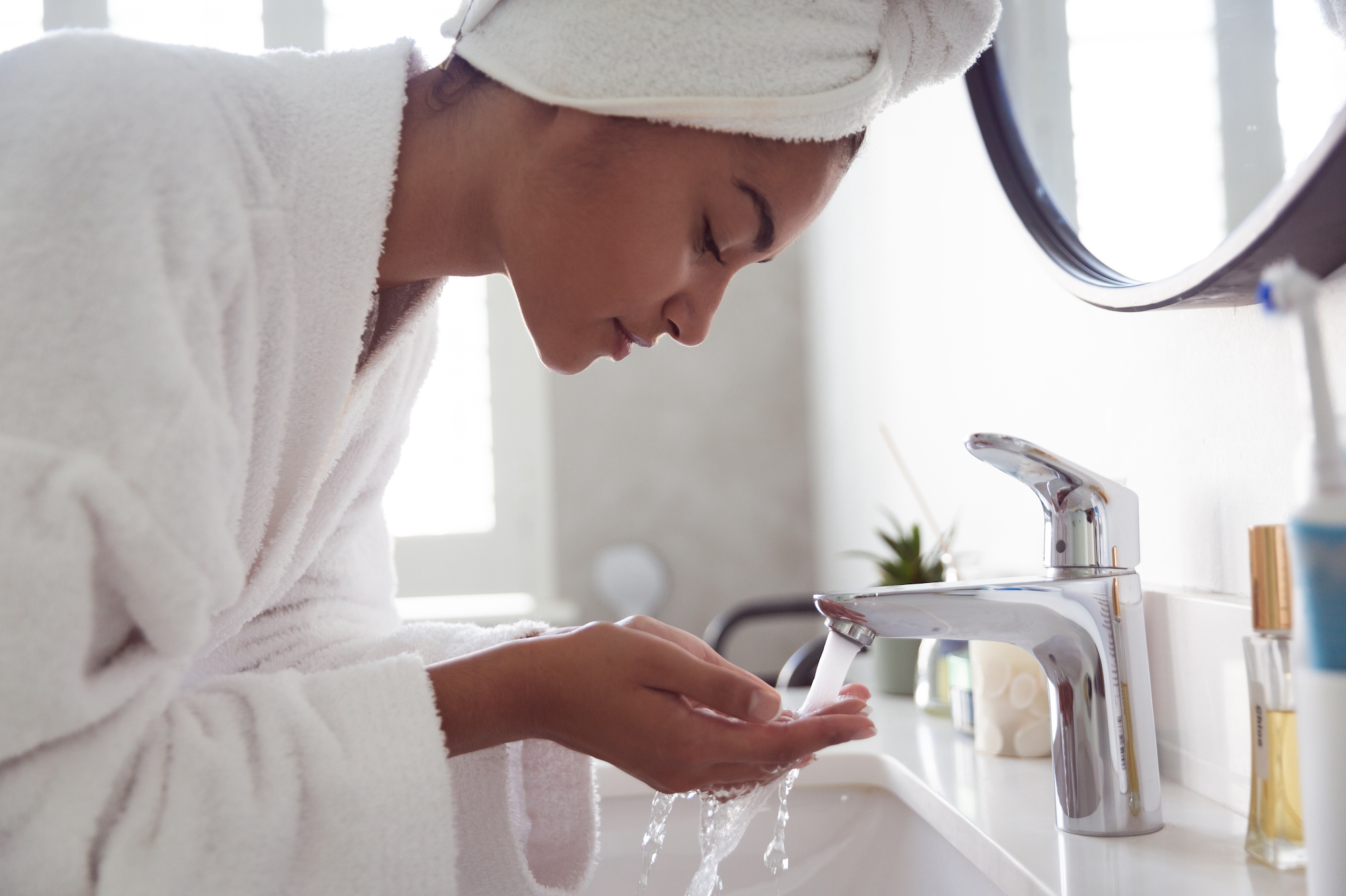 Woman-Washing-Face-Stock-Photo