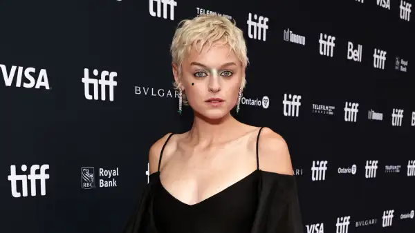Emma Corrin Wows in High-Cut Leotard, Fishnets and a Cape at Toronto Film Festival