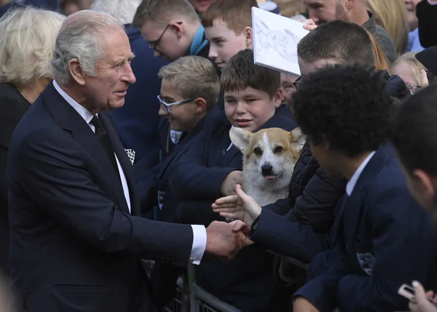 King Charles III and a corgi