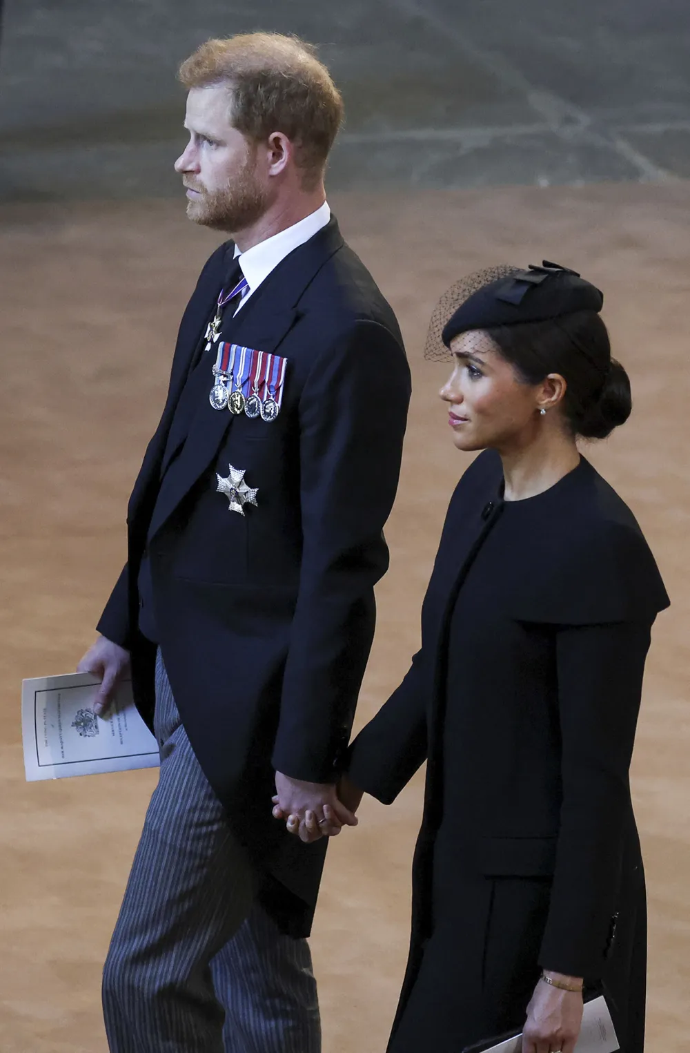 Prince Harry and Meghan Markle Hold Hands As They Exit Queen Elizabeth II&rsquo;s Westminster Hall Service