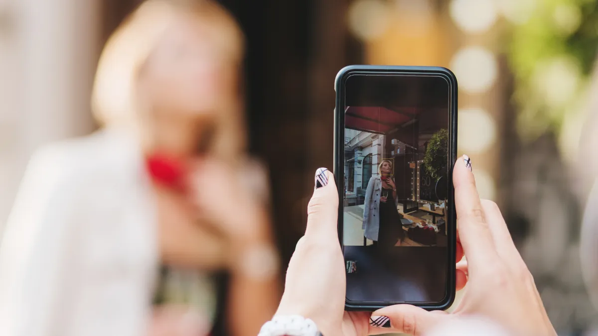 Woman-Taking-Instagram-Photo-Stock-Image