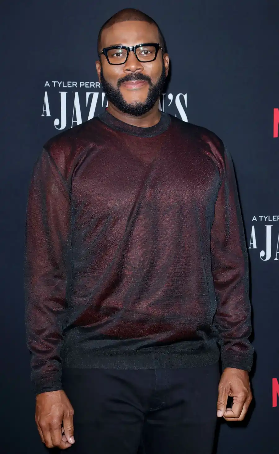 Jennifer Aniston, Steven Spielberg and More Celebs Who Are Godparents maroon shirt