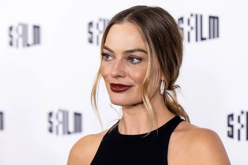Margot Robbie Reveals She Improvised a 'Babylon' Scene to Kiss Brad Pitt: &lsquo;Sue Me&rsquo; black dress