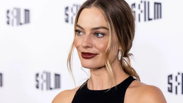 Margot Robbie Reveals She Improvised a 'Babylon' Scene to Kiss Brad Pitt: ‘Sue Me’ black dress