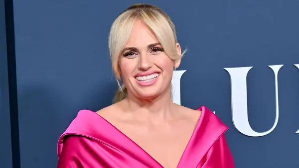Rebel Wilson Opens Up About 1st Kiss With A Woman: Lesbian Scene ‘Changed My Love Life Completely’ hot pink satin gown