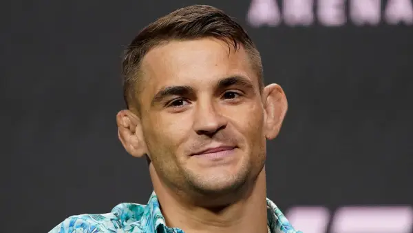 UFC Fighter Dustin Poirier: 25 Things You Don’t Know About Me (I Was Most Star Struck Meeting Mike Tyson!) blue aqua shirt