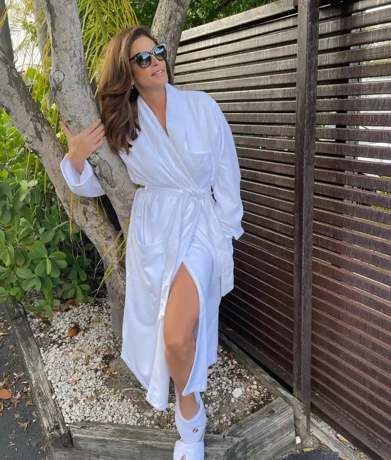 Cindy Crawford and Rande Gerber’s Relationship Timeline black dress white robe