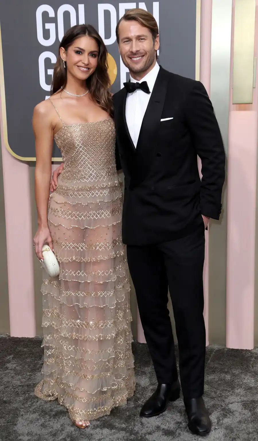Top Gun: Maverick’s Glen Powell and Model Gigi Paris’ Relationship Timeline Gold Dress Glen Powell and Gigi Paris Golden Globes 2023