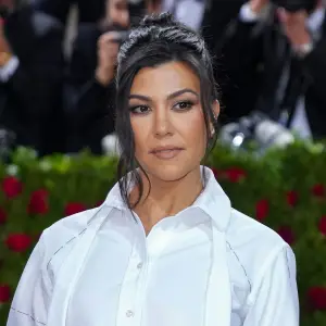 Kourtney K Does Pilates in Skims Pajamas white shirt