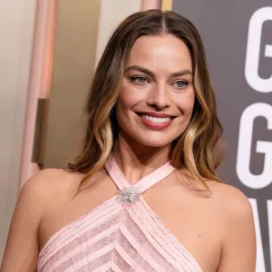 Margot Robbie Breakout Golden Globes 2023 open mouth smile