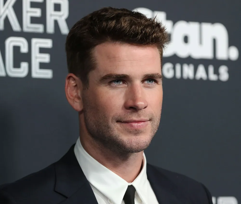 Miley Cyrus&rsquo; Sister Brandi Cyrus Acknowledges &lsquo;Flowers&rsquo; Fan Theories About Liam Hemsworth Update black suit