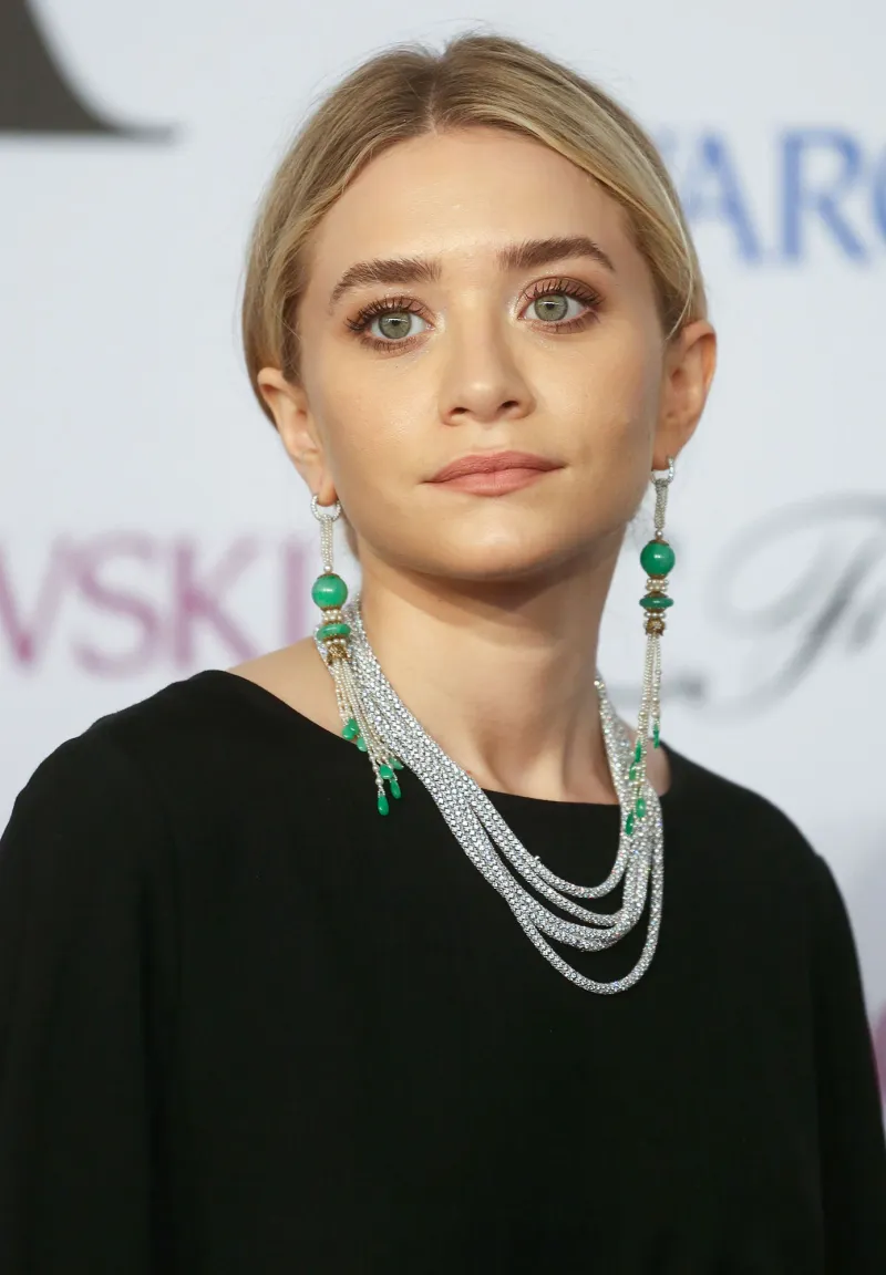 Photo Req: P2 - Luxury Handbag Shopping - Ashley Olsen and Louis turquoise earrings