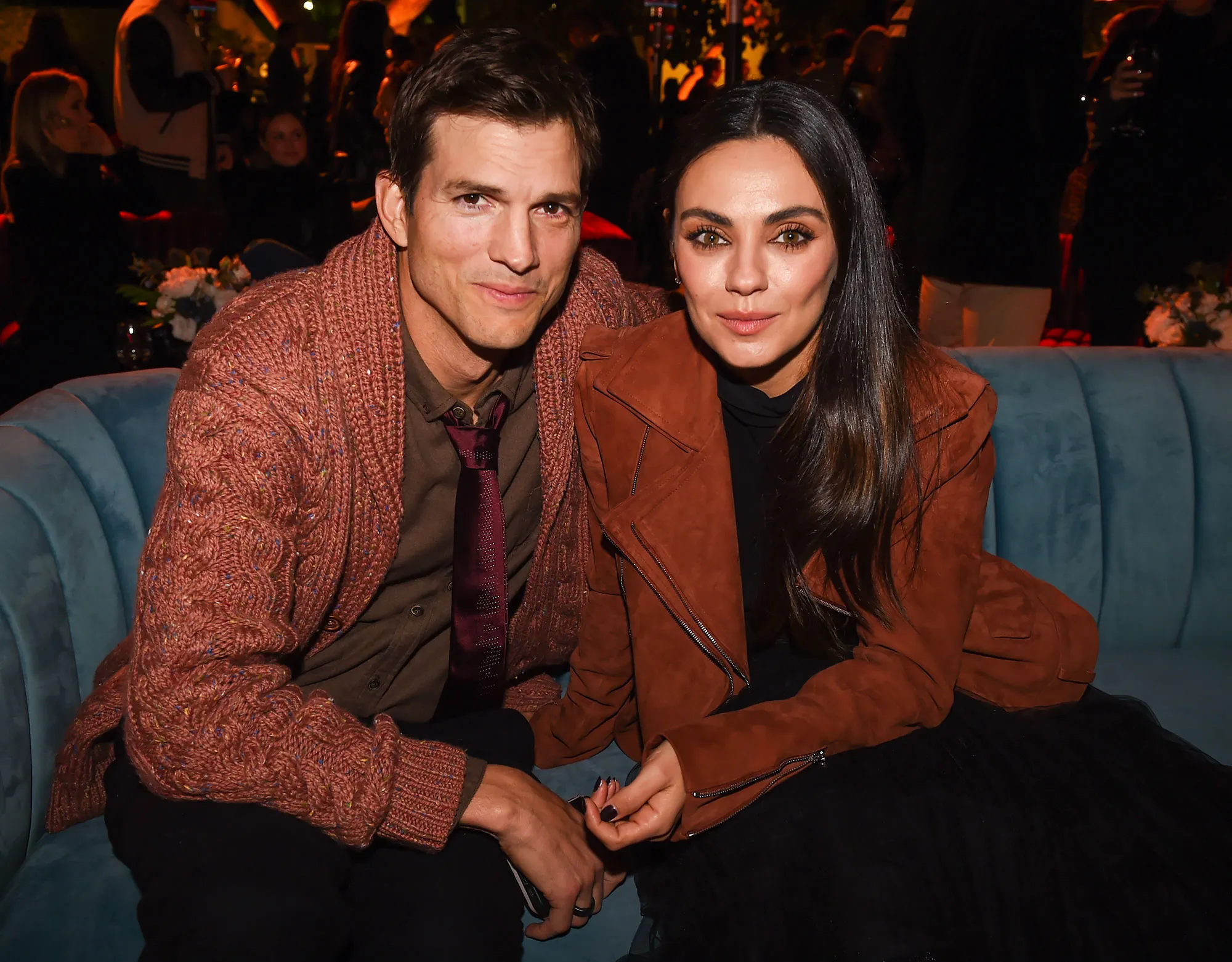 Ashton Kutcher and Mila Kunis&rsquo; Relationship Timeline orange jacket