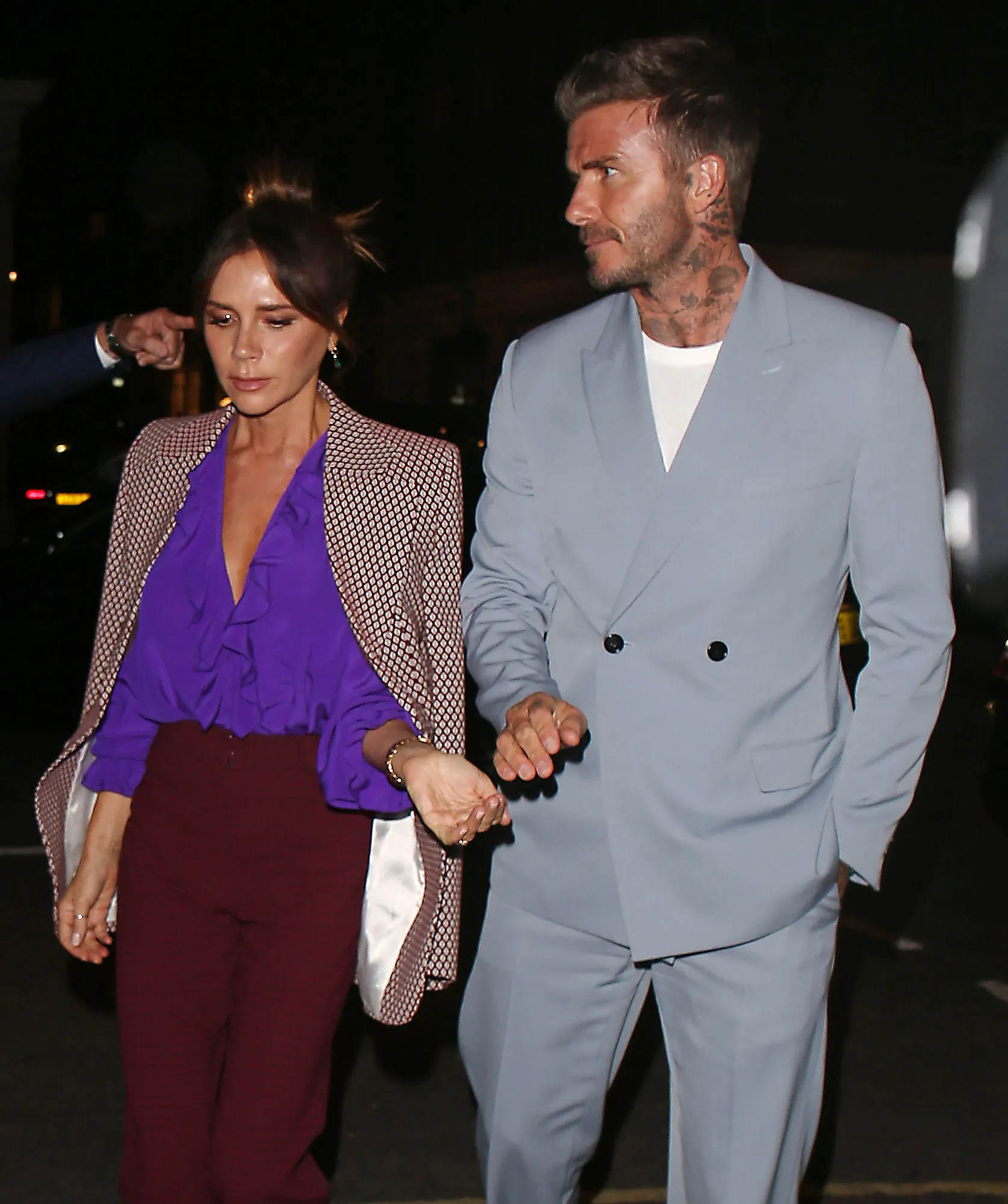 David and Victoria Beckham: A Timeline of Their Relationship purple shirt