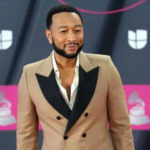 John Legend Works at CVS for the Day to Promote His New Skincare Line tan suit
