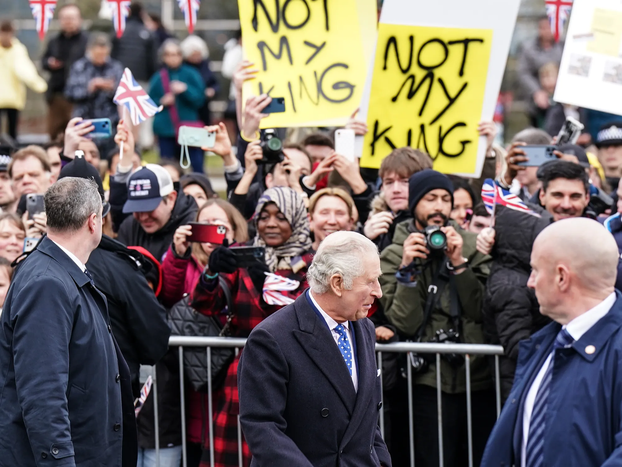King Charles III Ignores Protestors With 'Not My King' Signs Outside Royal Engagement in London