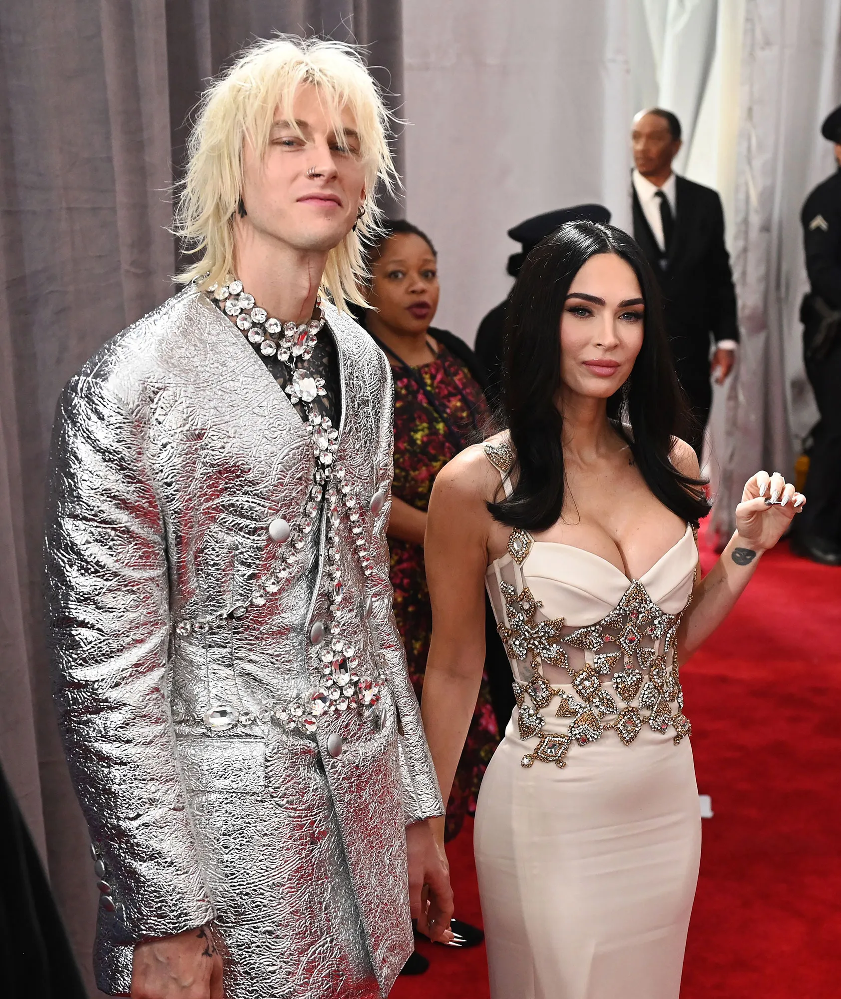 Megan Fox and Machine Gun Kelly&rsquo;s&rsquo; Quotes About Their Romance silver suit