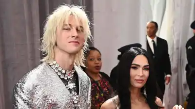 Megan Fox and Machine Gun Kelly’s’ Quotes About Their Romance silver suit