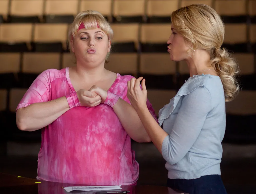 Rebel Wilson Claims She Wasn&rsquo;t Allowed to Lose &lsquo;More Than 10 Pounds&rsquo; While Filming &lsquo;Pitch Perfect&rsquo; Films pink shirt