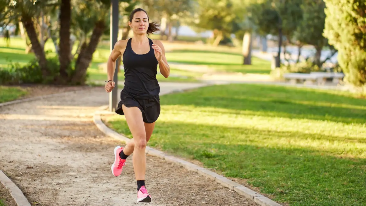Woman-Running-In-Workout-Shorts-Stock-Photo