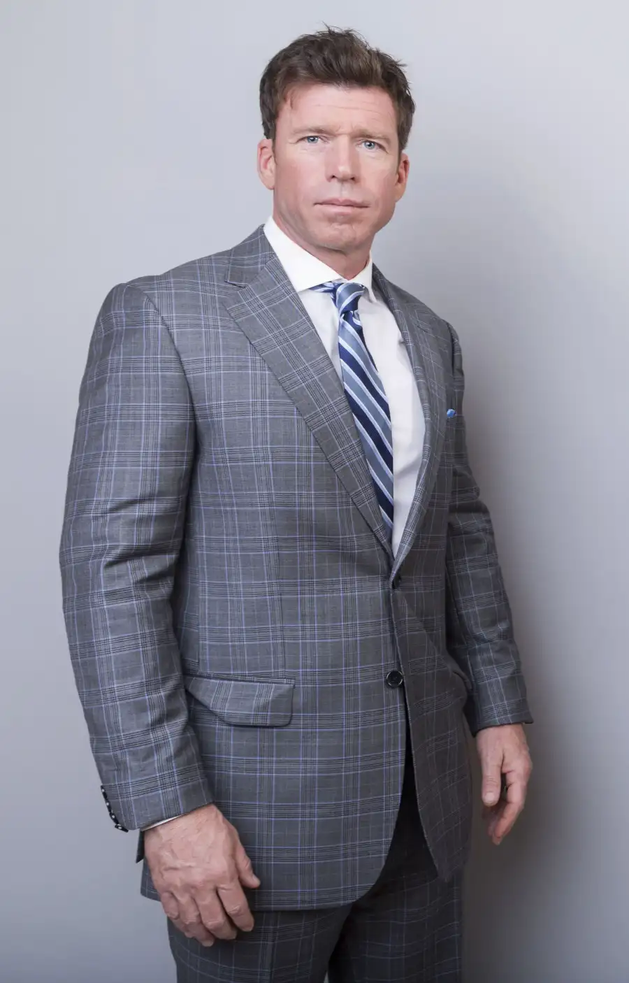 'Yellowstone' Off-Camera Drama Through the Years grey plaid suit