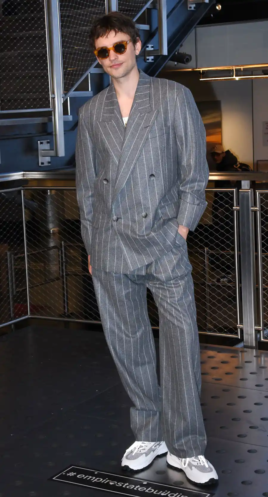 Best Daisy Jones & The Six Press Tour Looks grey pin stripe suit