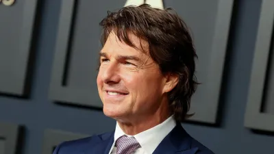 Tom Cruise Is 'Over the Moon' About Oscars Recognition for 'Top Gun' — and Pal Andrea Riseborough's Nomination blue suit