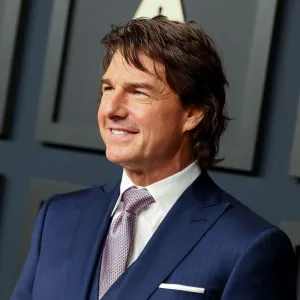 Tom Cruise Is 'Over the Moon' About Oscars Recognition for 'Top Gun' — and Pal Andrea Riseborough's Nomination blue suit