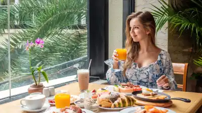 Woman-Having-Brunch-Stock-Photo