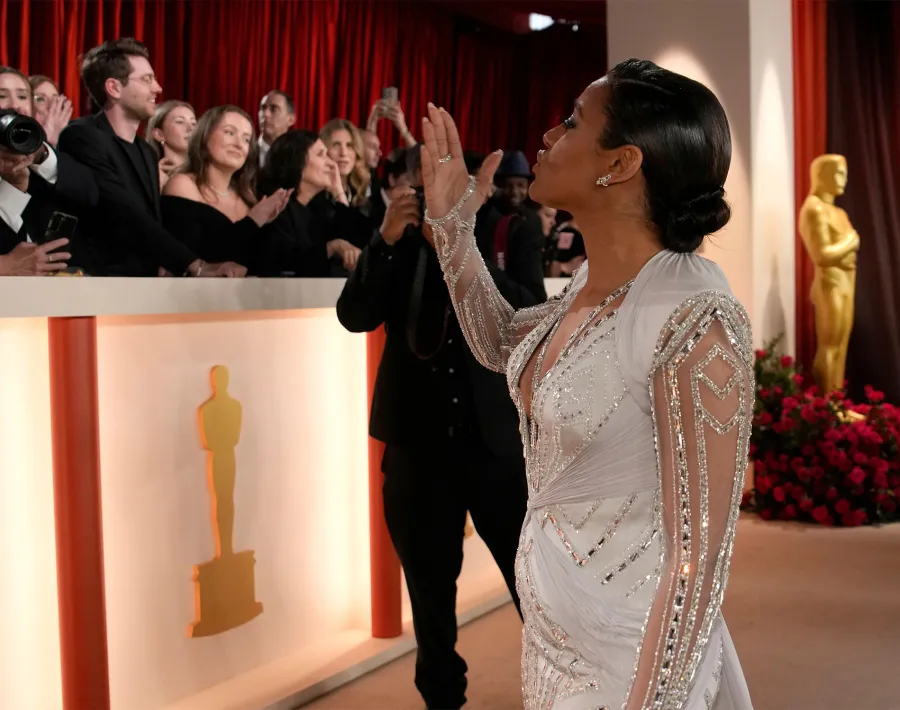 Ariana DeBose and Cara Delevigne hug
