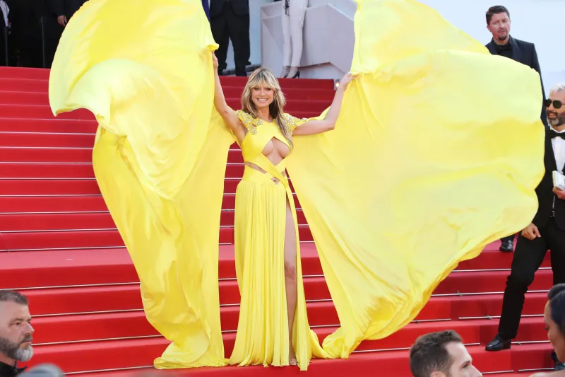Heidi Klum Suffers Nip Slip at Cannes at the 2023 Film Festival in Busy Yellow Gown: Photos