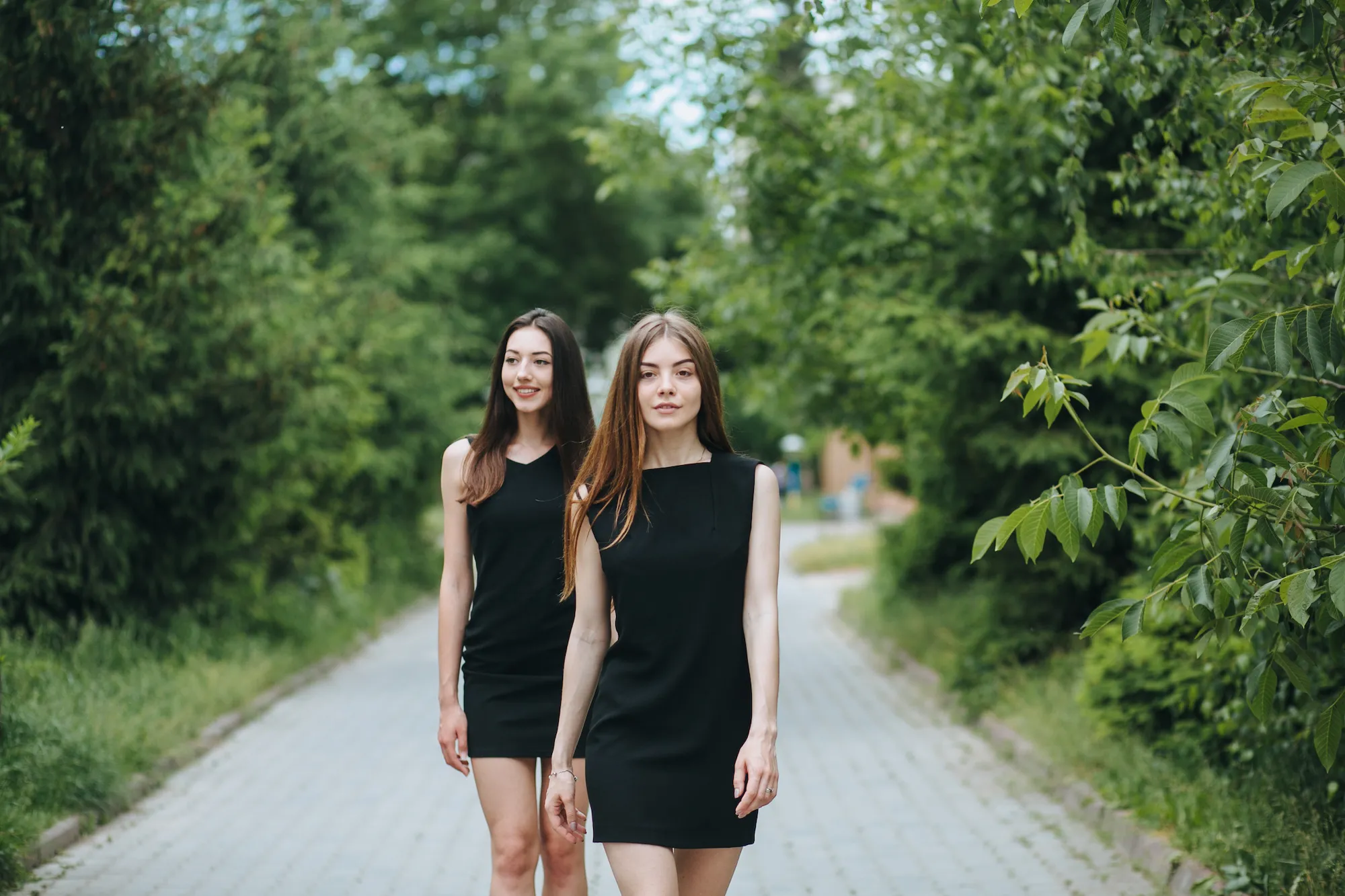 Two-Young-Women-In-Little-Black-Dresses-Stock-Photo