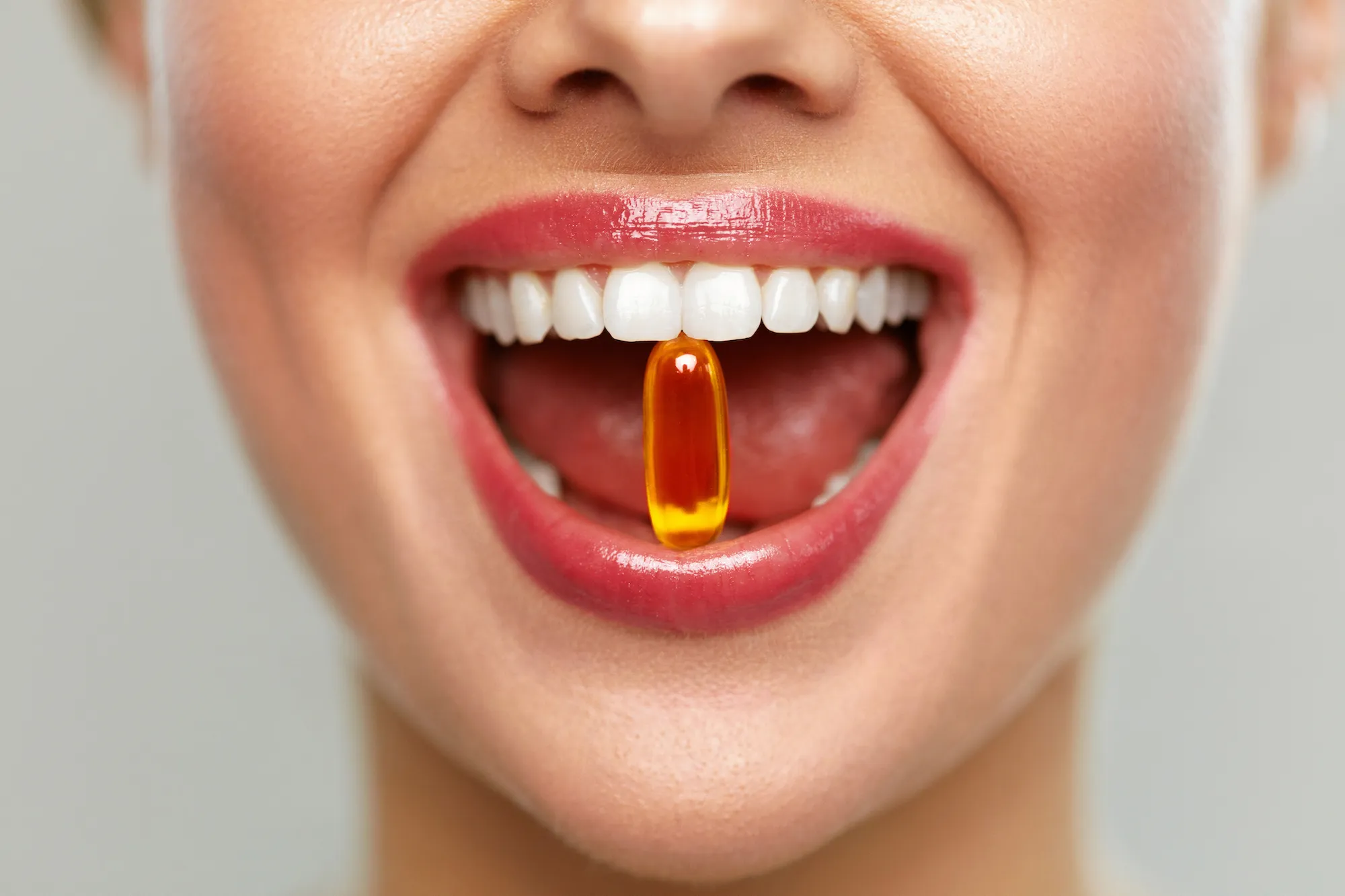 Woman-Taking-Vitamin-Closeup-Shot-Stock-Photo