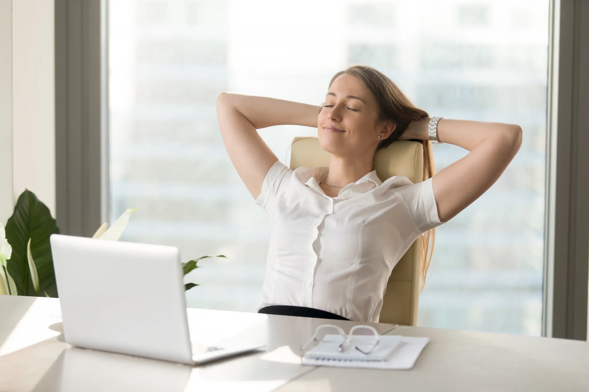 Woman-Without-Stress-At-Work-Desk-Stock-Photo