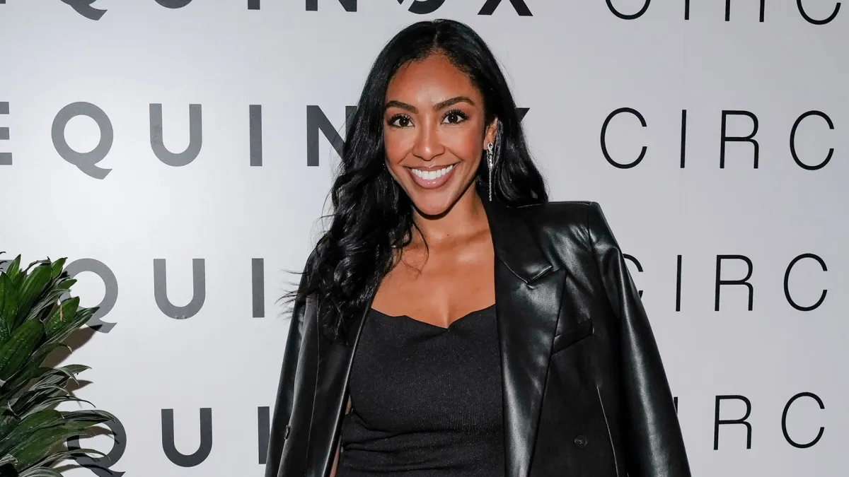 tayshia-adams-silver-bag