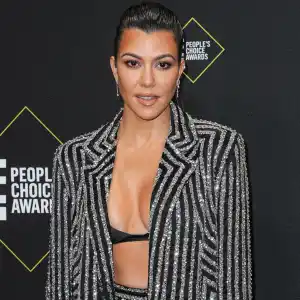 Pregnant Kourtney Kardashian Shows Off a Glimpse of Baby Bump in Black Swimsuit During Beach Day 304