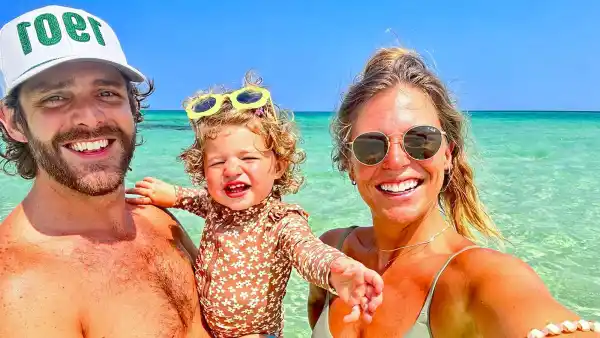 Shirtless Thomas Rhett Soaks Up Beach Time With Wife Lauren Akins and Their Youngest Daughter Lillie