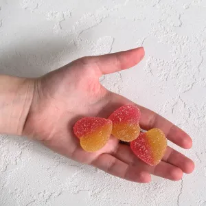 Two-Colored-Gummies-In-Hand-Stock-Photo