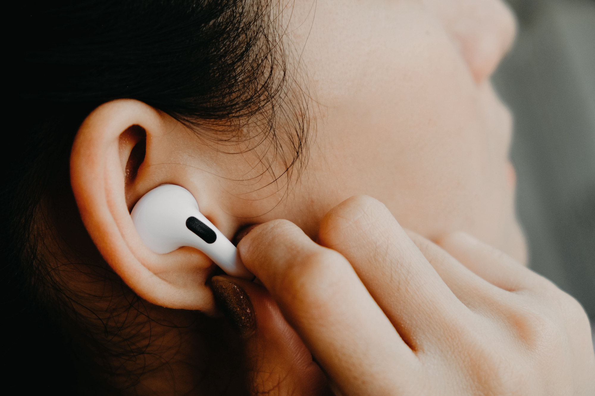 Woman-Wearing-Airpods-Pro-Headphones-Stock-Photo