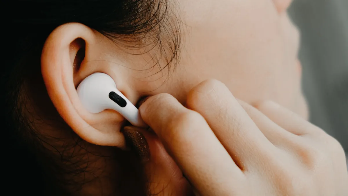 Woman-Wearing-Airpods-Pro-Headphones-Stock-Photo