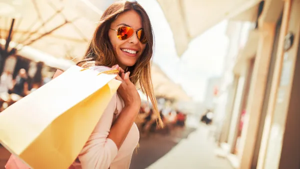 Woman-With-Shopping-Bags-Stock-Photo